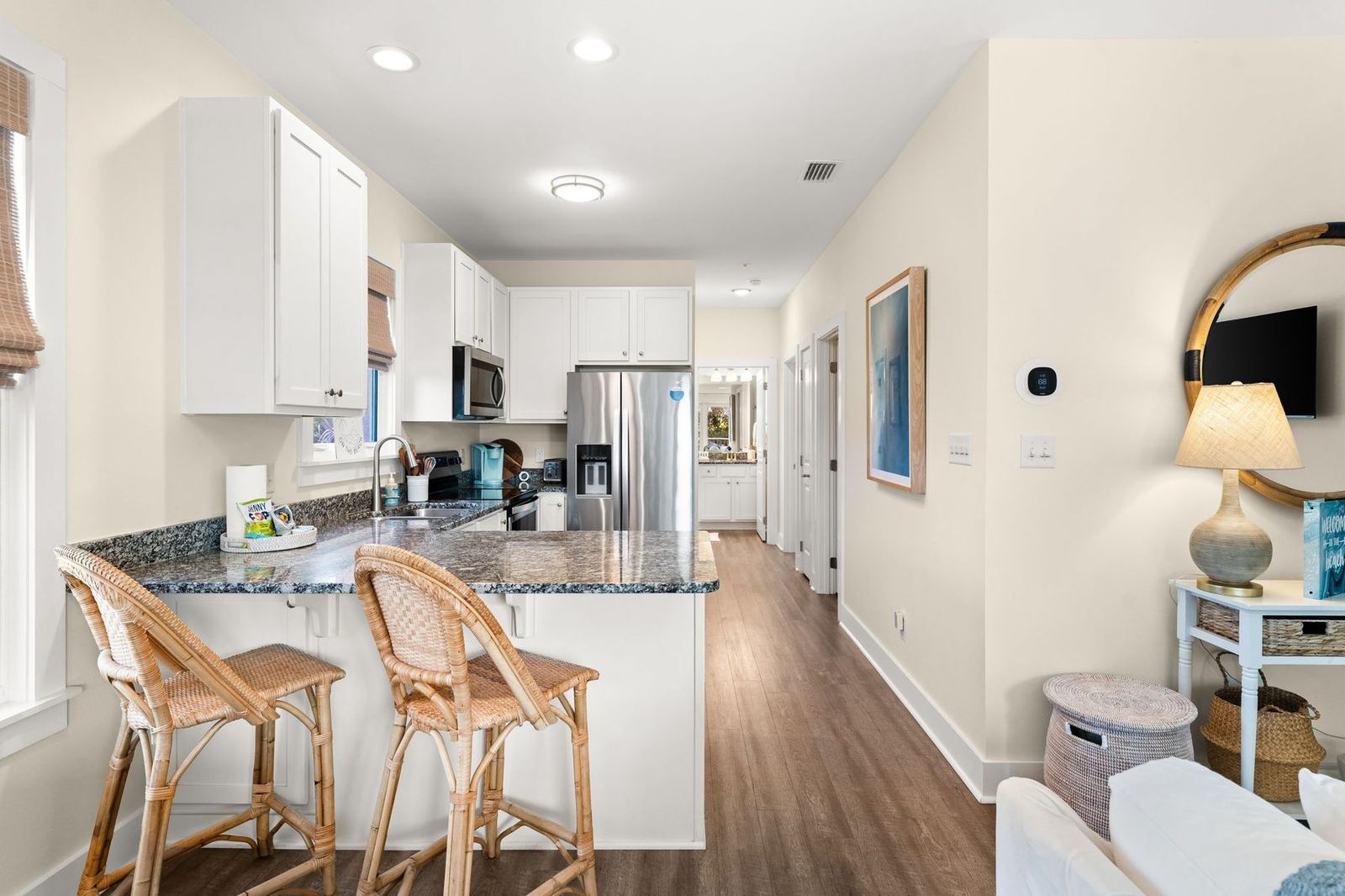 Full kitchen with granite counters and breakfast bar